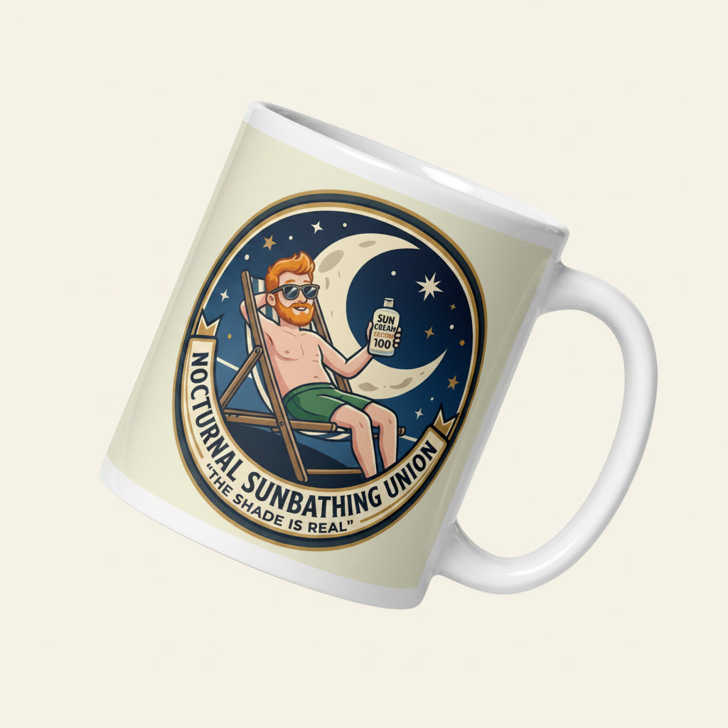 A circular illustration on a ceramic mug featuring a ginger man in sunglasses lounging on a deckchair at night. He is holding Factor 100 sun cream under a crescent moon. Text reads Nocturnal Sunbathing Union, The Shade is Real.