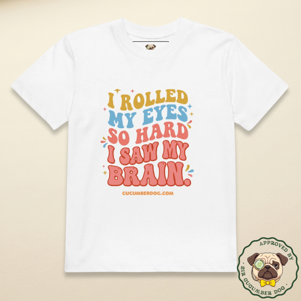 A white organic cotton children's t-shirt featuring colourful retro typography that reads: I ROLLED MY EYES SO HARD I SAW MY BRAIN. cucumberdog.com.