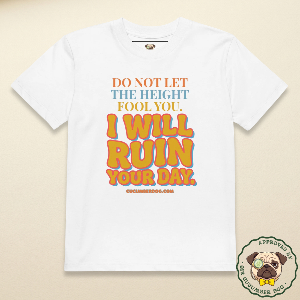 A white organic cotton children's t-shirt featuring retro colourful typography that reads: DO NOT LET THE HEIGHT FOOL YOU. I WILL RUIN YOUR DAY. cucumberdog.com.
