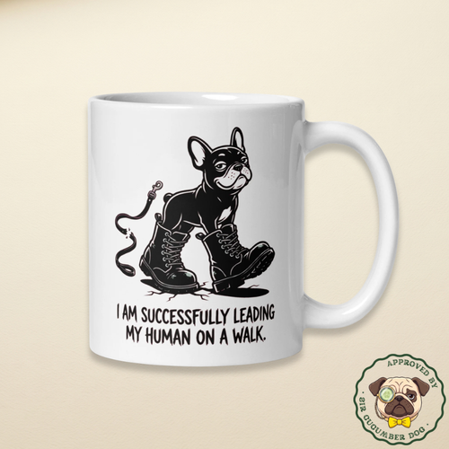 I am successfully leading my human on a walk with a French bulldog in boots design on a white mug