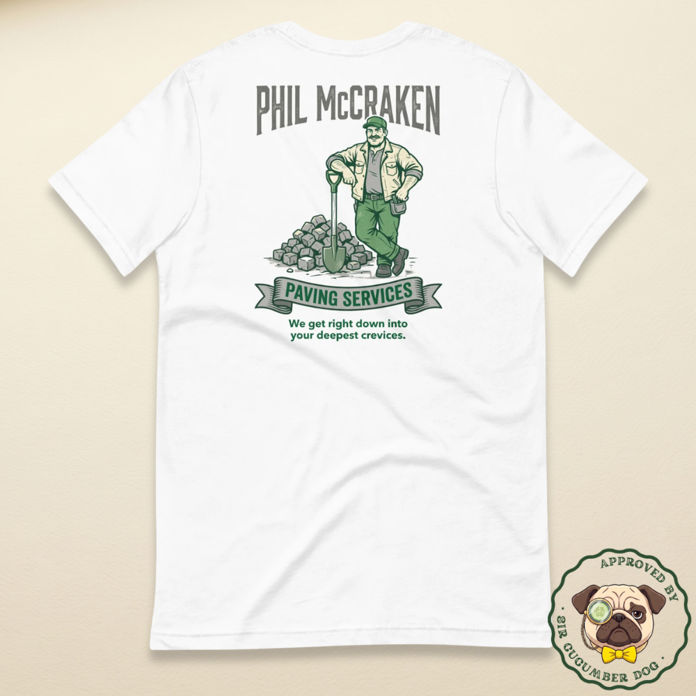 A vintage illustration of a male paving contractor leaning on a shovel next to a pile of cobblestones, featuring the text Phil McCraken Paving Services printed on the back of a white t-shirt.