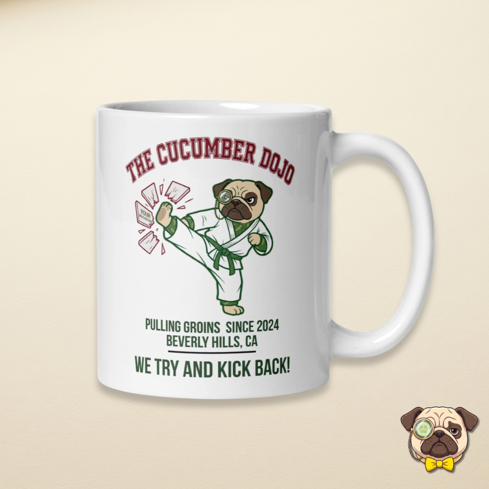 The cucumber dojo featuring Sir Cucumber Dog wearing a karate robe design on a white mug