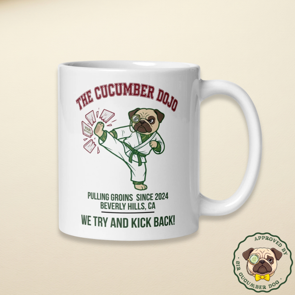The cucumber dojo featuring Sir Cucumber Dog wearing a karate robe design on a white mug