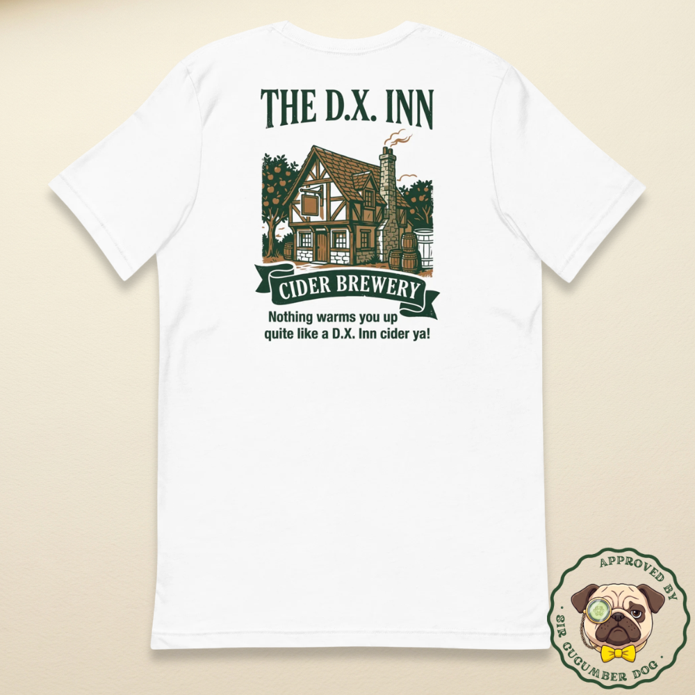 Vintage style illustration on the back of a white t-shirt featuring a timber-framed Tudor style cider brewery with barrels, an orchard, and smoke rising from the chimney. The bold text above and below reads The D.X. Inn Cider Brewery, Nothing warms you up quite like a D.X. Inn cider ya!