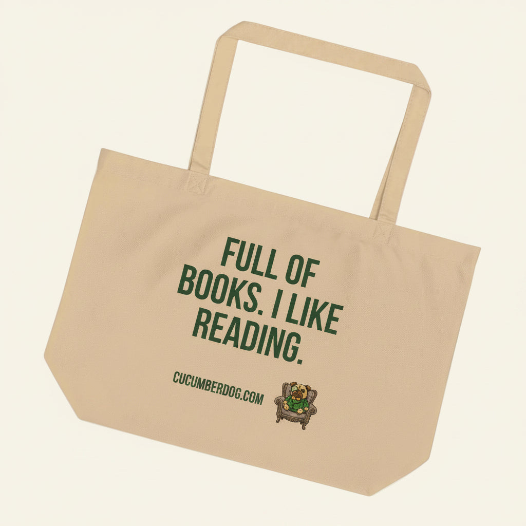 A heavy duty oyster coloured organic cotton tote bag featuring bold Cucumber green text that reads FULL OF BOOKS. I LIKE READING. Below the text is the website CUCUMBERDOG.COM and a small illustration of Sir Cucumber Dog, a pug wearing a green cucumber print suit and monocle, sitting in a dapper armchair.