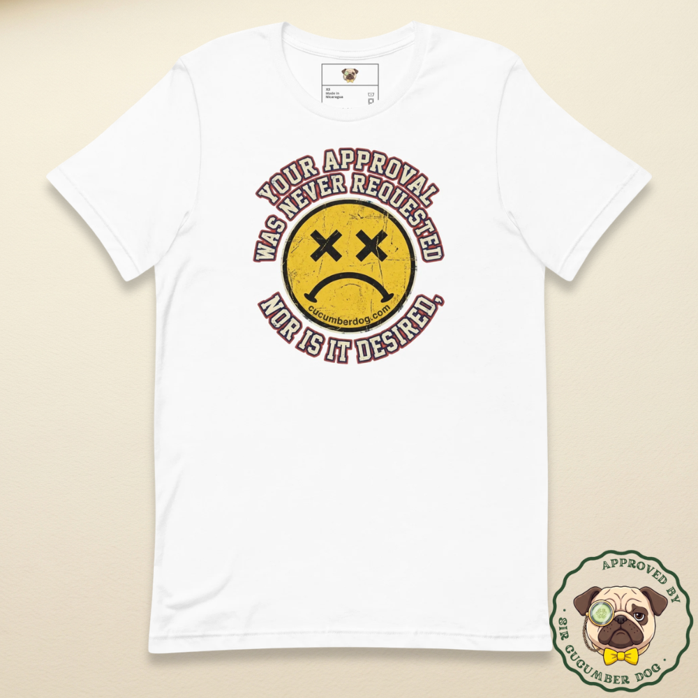 Distressed grunge graphic on a white t-shirt featuring a yellow smiley face with X eyes and a sad mouth. The bold text reads Your approval was never requested, nor is it desired