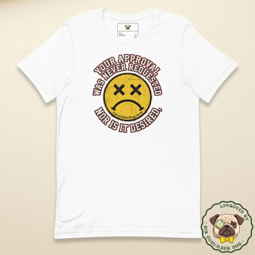 Distressed grunge graphic on a white t-shirt featuring a yellow smiley face with X eyes and a sad mouth. The bold text reads Your approval was never requested, nor is it desired