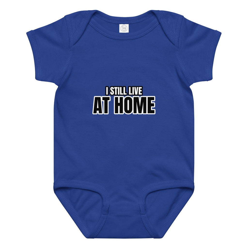 Blue baby onesie with 'I STILL LIVE AT HOME' text on a white background. Cucumber Dog. 