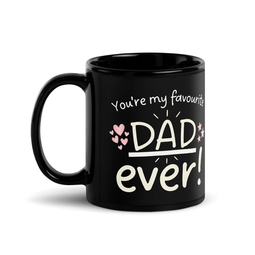 A black ceramic mug on a white background. The design features white hand drawn typography that reads YOU RE MY FAVOURITE DAD EVER!. Small pink hearts decorate the left side of the text and three pink stars are on the right side. The word DAD is underlined and in a larger font.
