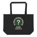 A large black eco tote bag featuring a green circle with a question mark and the text The Precise Guesswork Association, Never Right, Never In Doubt.
