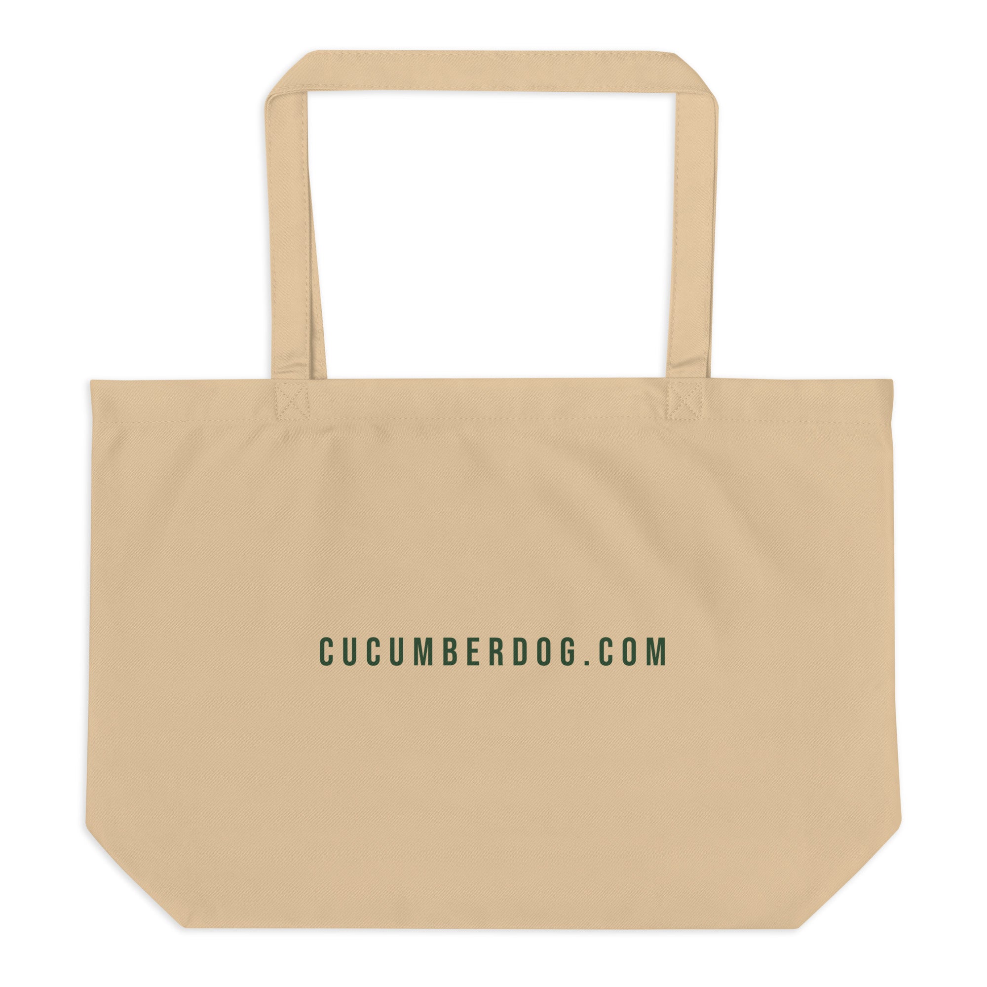 A heavy duty oyster coloured organic cotton tote bag. The front features the text LE SAC DE TOUT over a green banner reading FACTORY MADE. Below is a plush pug named Sir Cucumber Dog wearing a green suit and monocle, followed by the text CONTAINS NOTHING. PARIS. LONDON. TOKYO. The back displays the text CUCUMBERDOG.COM in green.