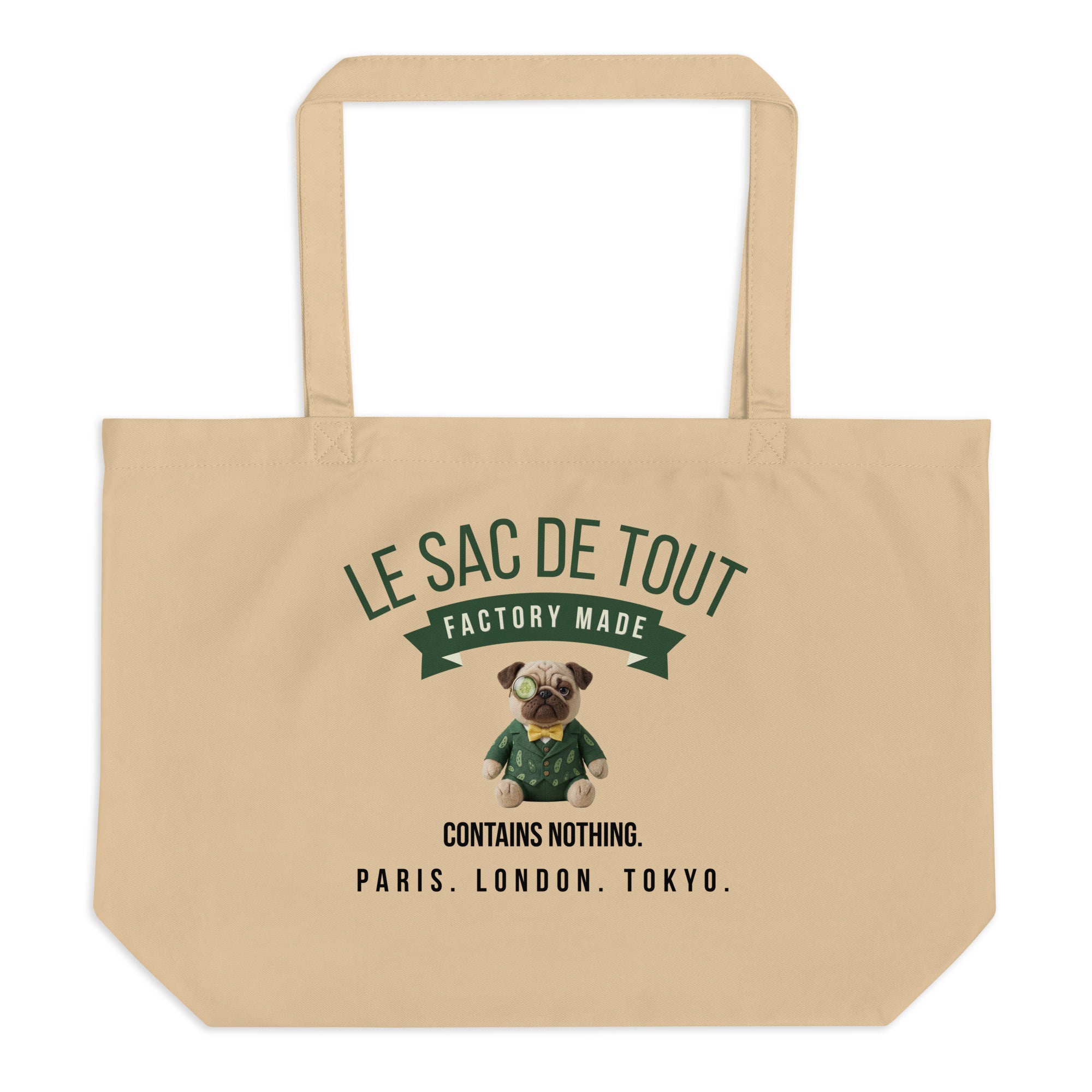 A heavy duty oyster coloured organic cotton tote bag. The front features the text LE SAC DE TOUT over a green banner reading FACTORY MADE. Below is a plush pug named Sir Cucumber Dog wearing a green suit and monocle, followed by the text CONTAINS NOTHING. PARIS. LONDON. TOKYO. The back displays the text CUCUMBERDOG.COM in green.
