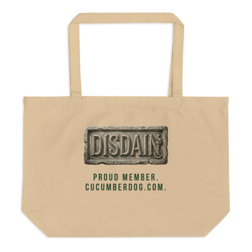 A heavy duty oyster organic cotton tote bag featuring a black rectangular print. Inside the black area is a realistic 3D stone carving of the word DISDAIN with Sir Cucumber Dog's profile hidden in the letter N. Green text below reads PROUD MEMBER CUCUMBERDOG.COM.The Artefact of Avoidance: "Disdain" Stone Relief Tote