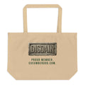 A heavy duty oyster organic cotton tote bag featuring a black rectangular print. Inside the black area is a realistic 3D stone carving of the word DISDAIN with Sir Cucumber Dog's profile hidden in the letter N. Green text below reads PROUD MEMBER CUCUMBERDOG.COM.The Artefact of Avoidance: "Disdain" Stone Relief Tote