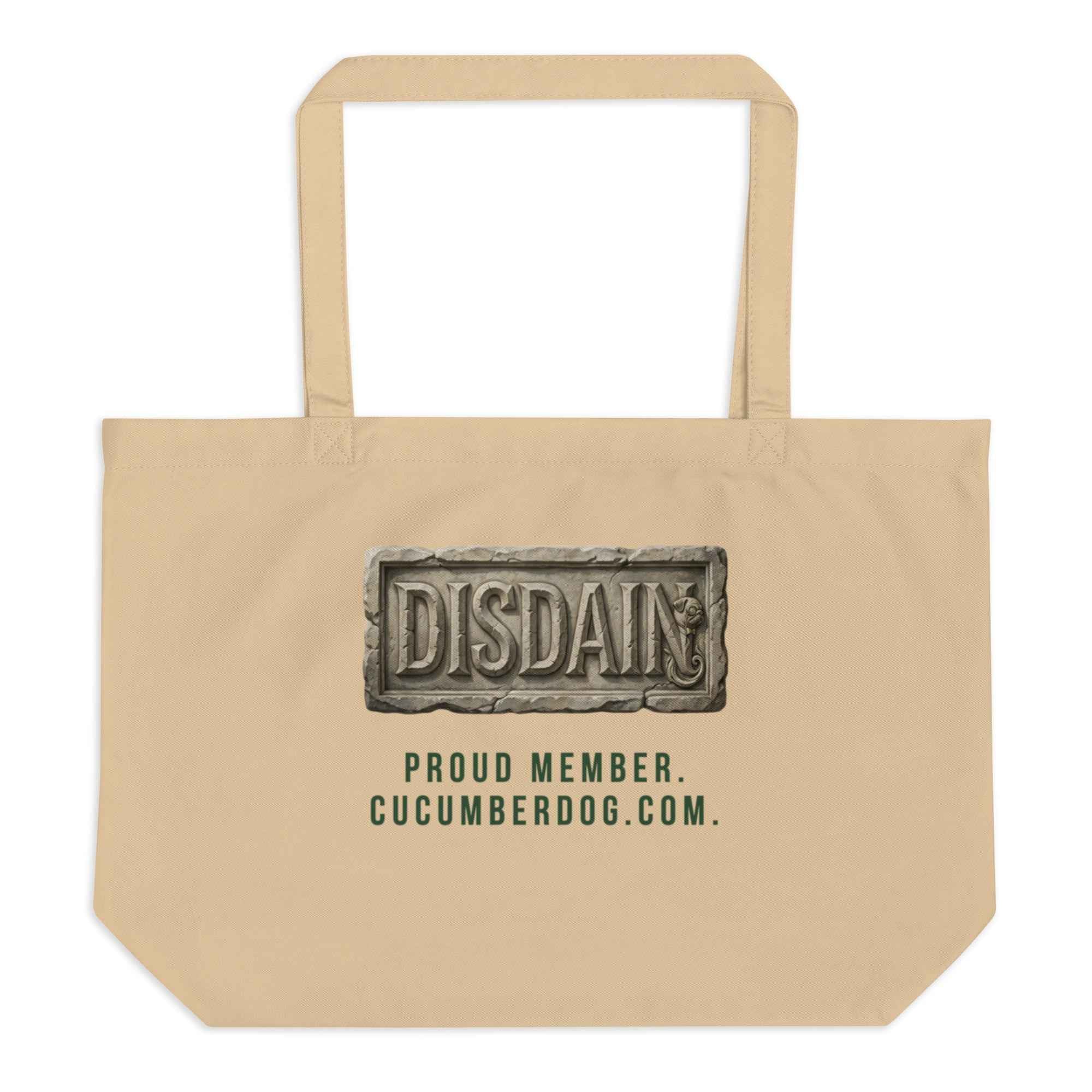 A heavy duty oyster organic cotton tote bag featuring a black rectangular print. Inside the black area is a realistic 3D stone carving of the word DISDAIN with Sir Cucumber Dog's profile hidden in the letter N. Green text below reads PROUD MEMBER CUCUMBERDOG.COM.The Artefact of Avoidance: "Disdain" Stone Relief Tote