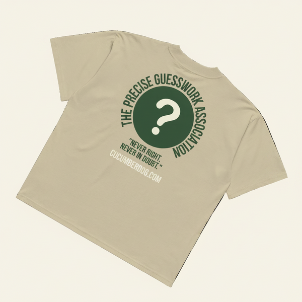 Back of an oversized t-shirt in stone, black, french navy or white, featuring a green circle with a question mark and the text The Precise Guesswork Association, Never Right, Never In Doubt.