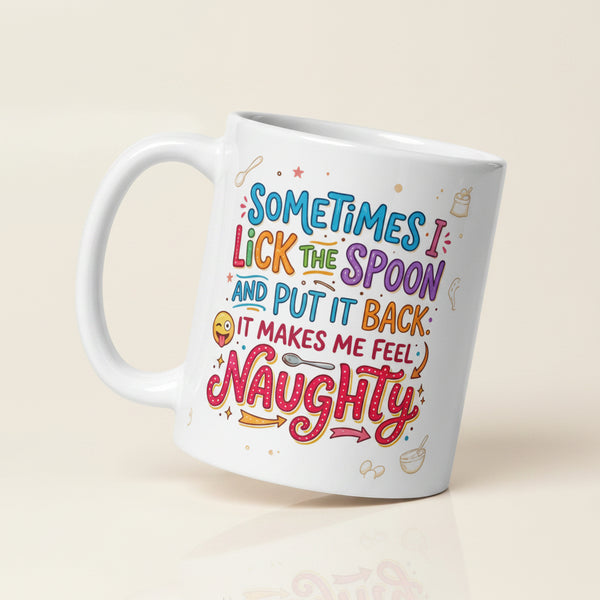 A white ceramic mug featuring playful and colourful typography in blue, pink, orange, and purple. The text reads SOMETIMES I LICK THE SPOON AND PUT IT BACK IT MAKES ME FEEL NAUGHTY. The design is decorated with small hand drawn icons of spoons, stars, a bag of flour, and a winking emoji with its tongue sticking out.