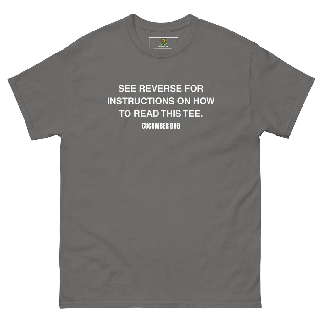 Gray t-shirt with the words see reverse for instructions on how to read this tee. White text on a white background. Cucumber Dog