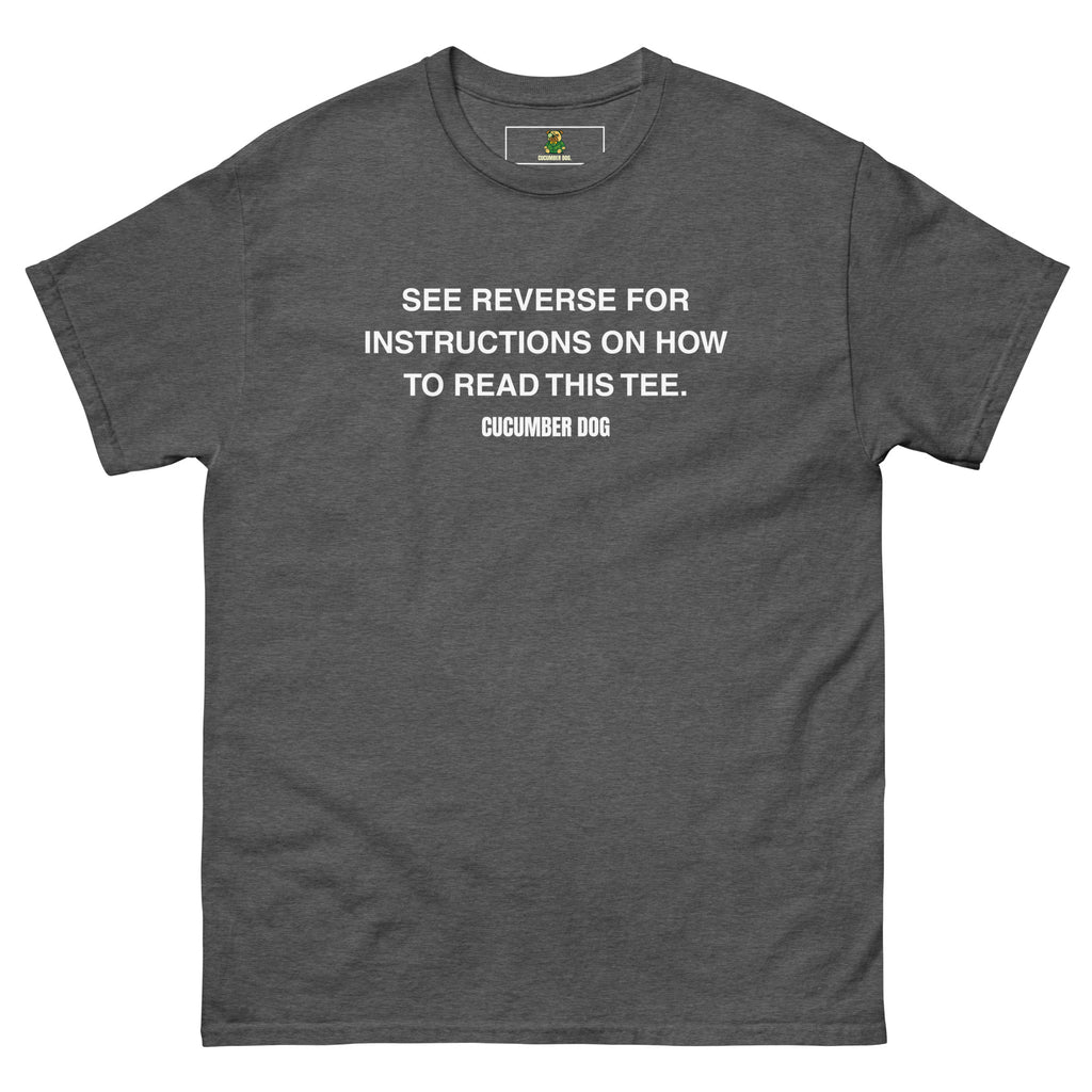 Gray t-shirt with the words see reverse for instructions on how to read this tee. White text on a white background. Cucumber Dog