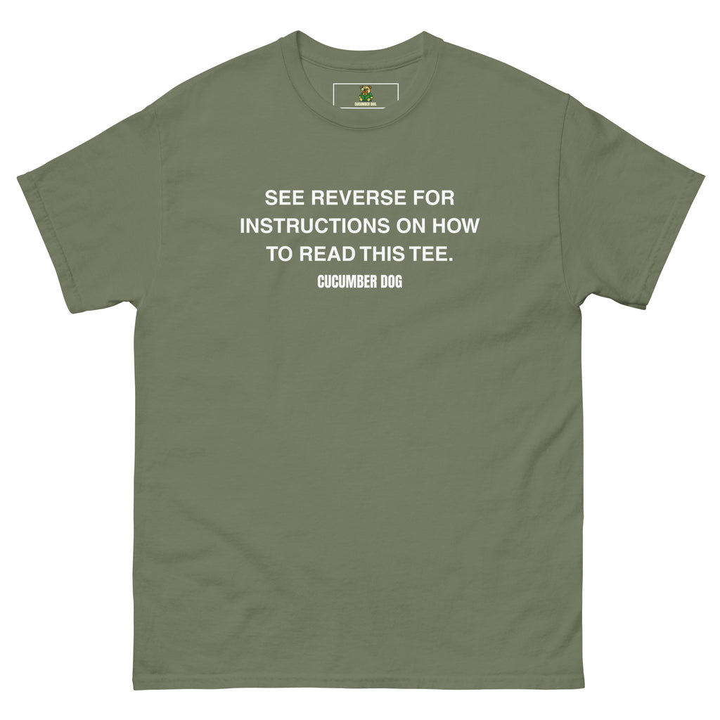 Green t-shirt with the words see reverse for instructions on how to read this tee. White text on a white background. Cucumber Dog