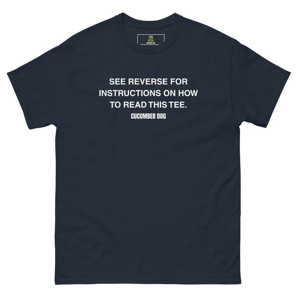 Navy t-shirt with the words see reverse for instructions on how to read this tee. White text on a white background. Cucumber Dog