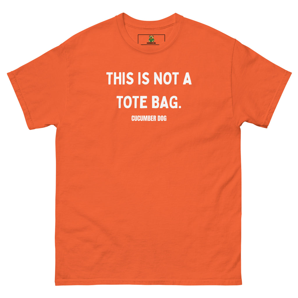 Orange t-shirt with the words This Is Not A Tote Bag in white text on a white background. Cucumber Dog
