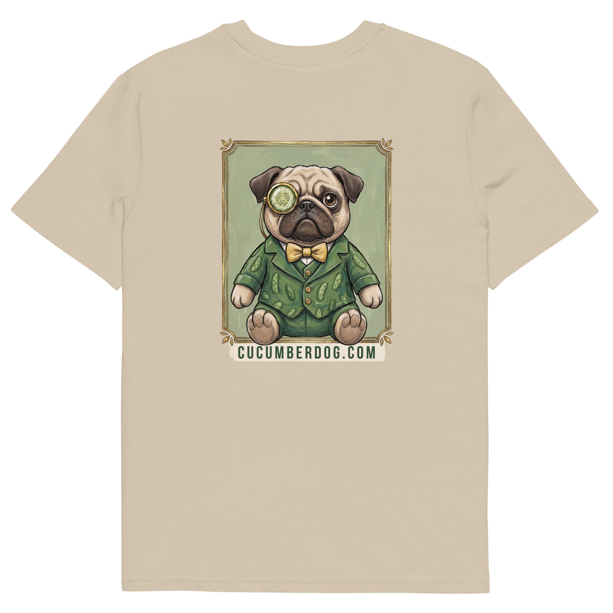 The back of a light sand coloured t-shirt. It features a vintage style framed illustration of Sir Cucumber Dog, a pug wearing a green cucumber print suit, yellow bow tie, and a monocle. The text below the portrait reads CUCUMBERDOG.COM.