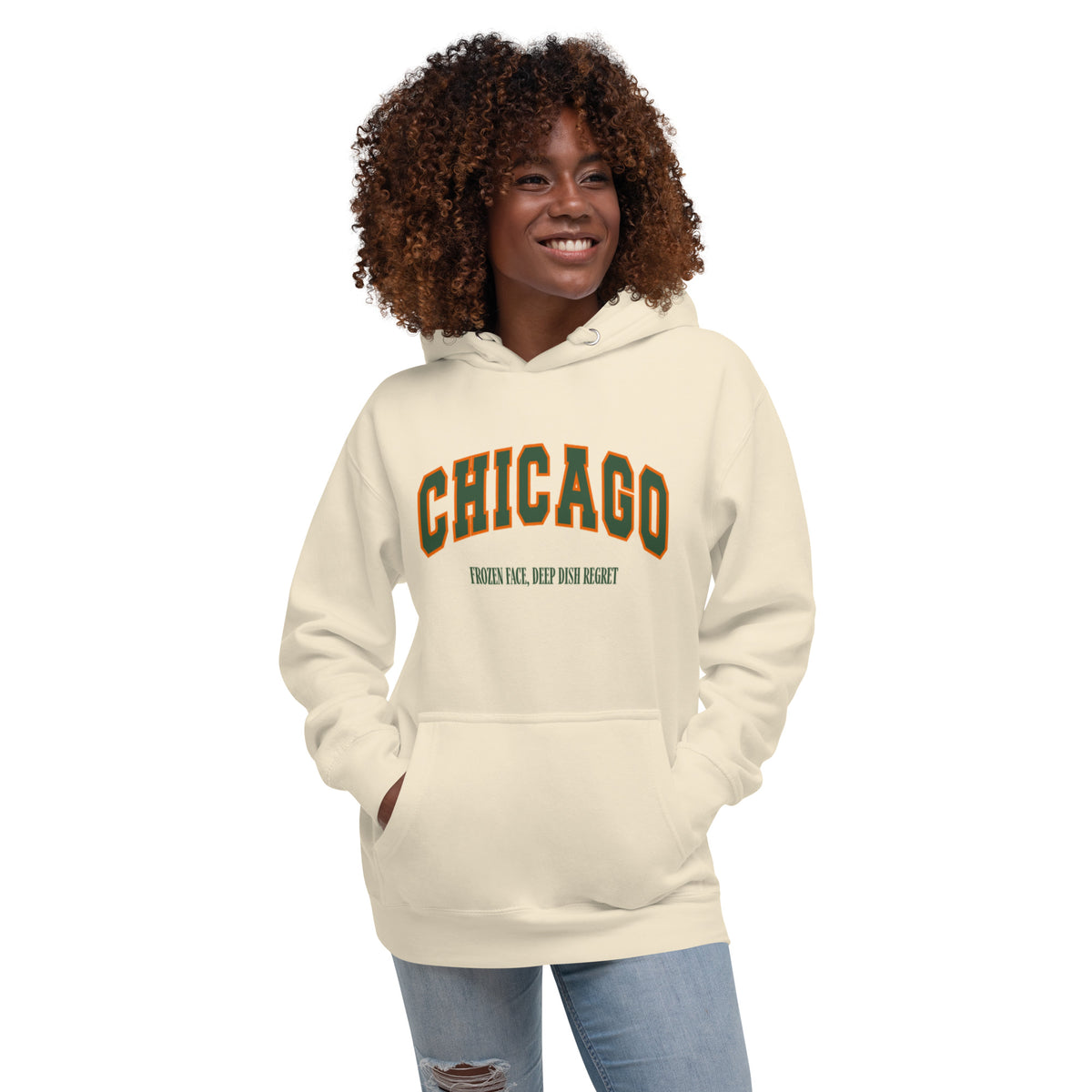 Bone hoodie featuring a vintage athletic graphic with arched Chicago text in green and orange, and the phrase Frozen Face, Deep Dish Regret underneath in a green serif font.