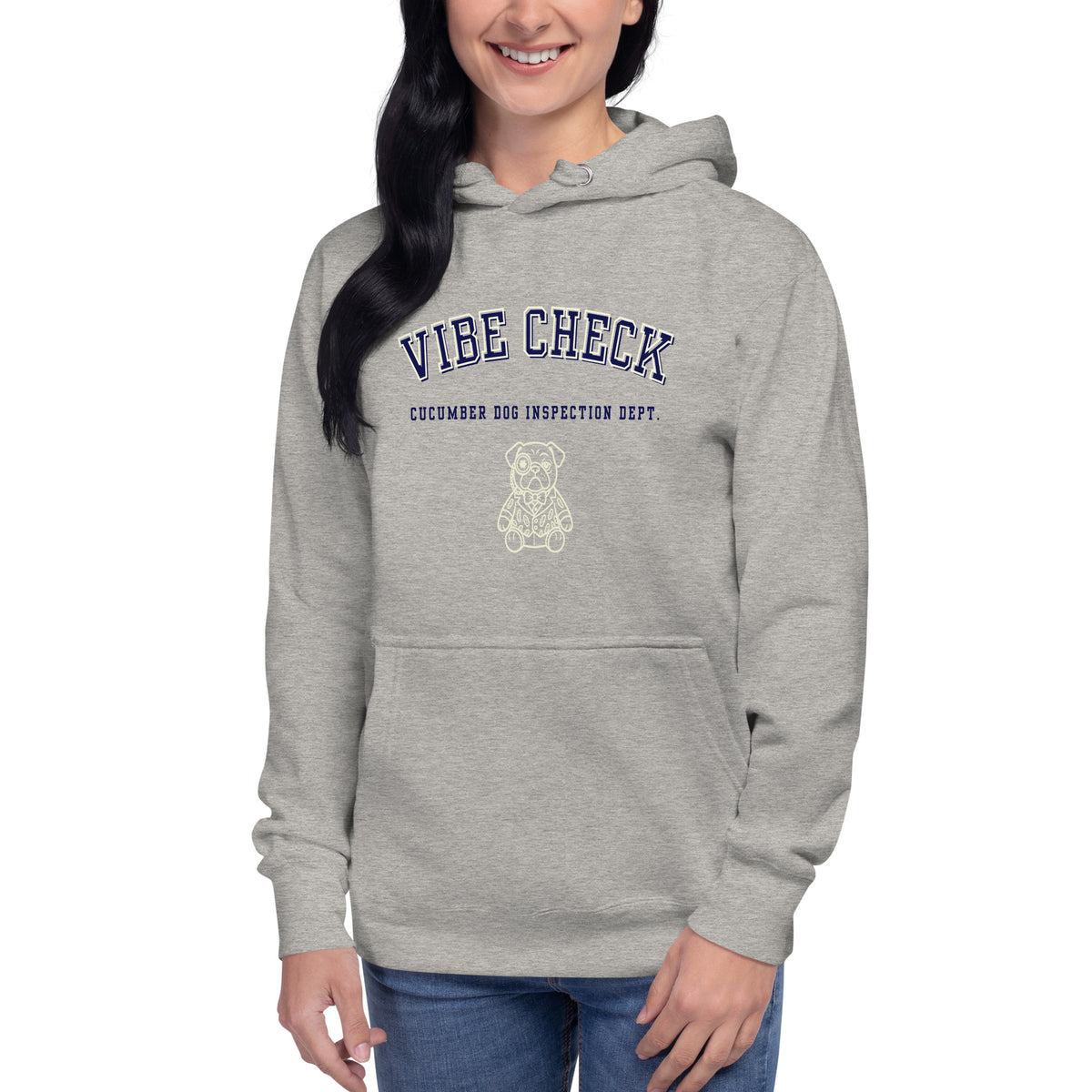 Carbon grey hoodie featuring the text Vibe Check in arched navy collegiate typography above Cucumber Dog Inspection Dept and a cream line art portrait of a pug in a suit.