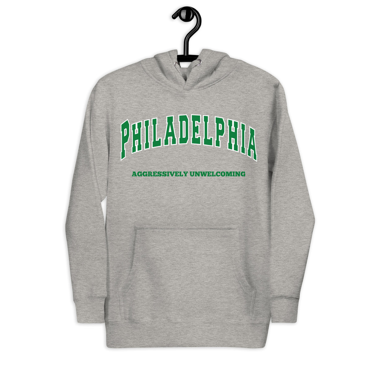 Premium carbon grey hoodie featuring a vintage athletic graphic with arched Philadelphia text in green and white, and the phrase Aggressively Unwelcoming printed underneath in a solid green serif font.