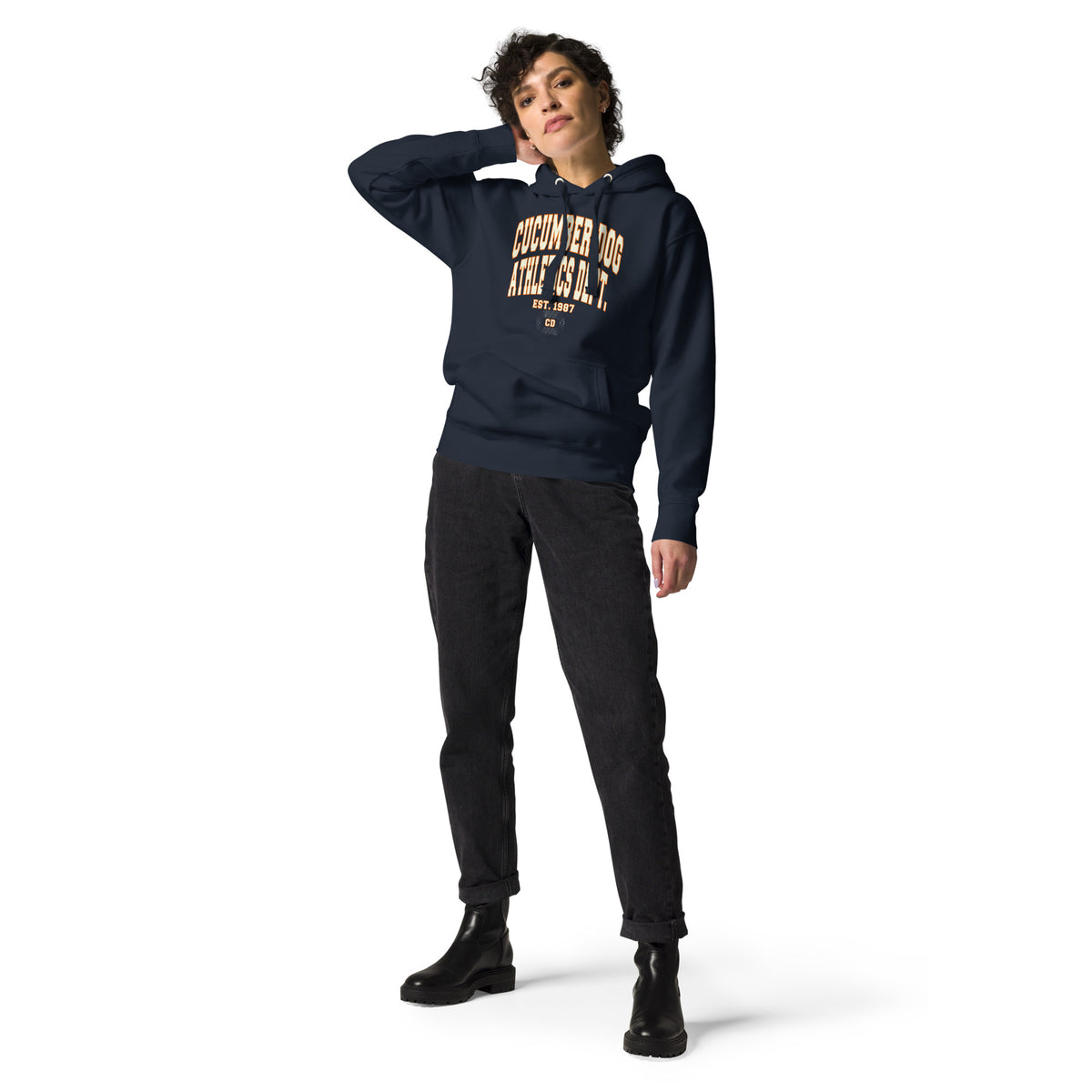 Premium navy blue hoodie featuring a vintage athletic graphic with arched Cucumber Dog and Athletics Dept text in white block typography with an orange outline, above Est. 1987 and a track motif framing the CD monogram.