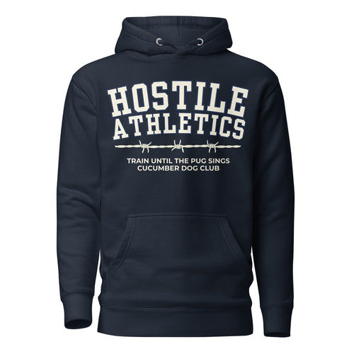 Premium navy blue hoodie featuring a vintage athletic graphic with arched Hostile Athletics text in white, a barbed wire motif, and text reading Train Until The Pug Sings and Cucumber Dog Club.