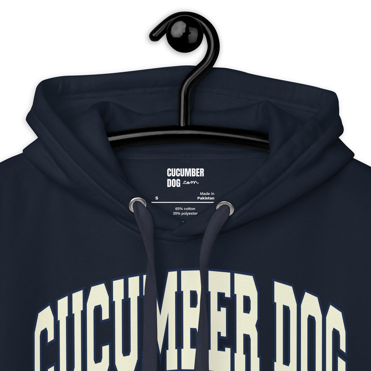 Navy hoodie featuring a monochromatic collegiate graphic with arched Cucumber Dog and Athletics Dept text in solid cream, Est. 1987, and a track motif framing the CD monogram. Showing the collar and the cucumber dog logo.