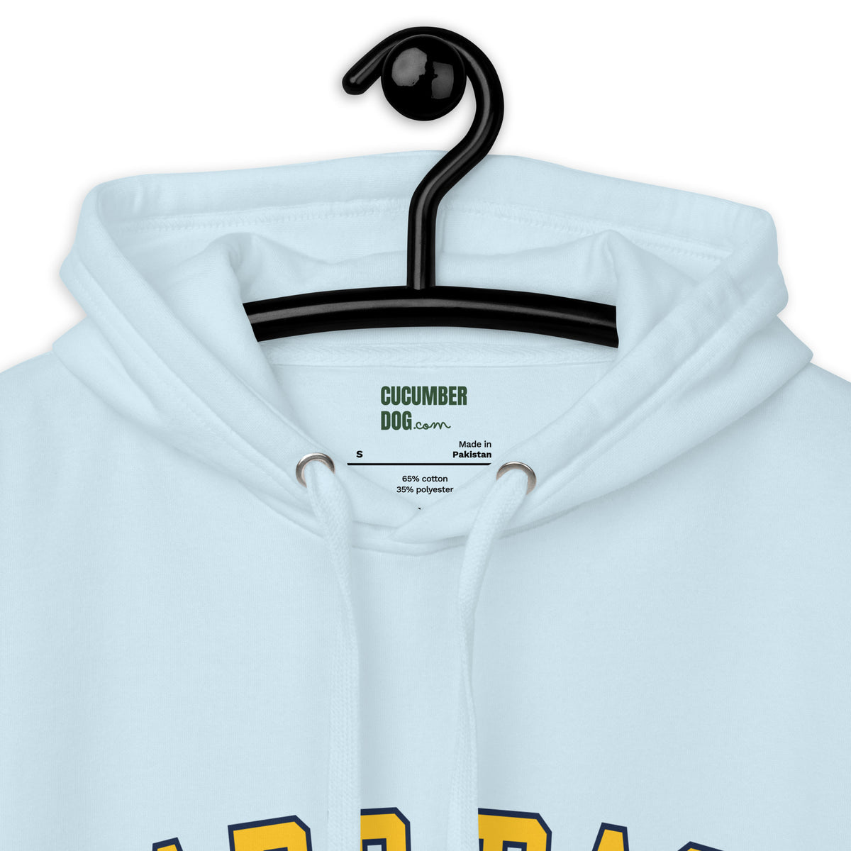 Sky blue hoodie featuring the text Hard Pass in arched yellow collegiate typography above Cucumber Dog Avoidance Society in navy text. Also the label on view.