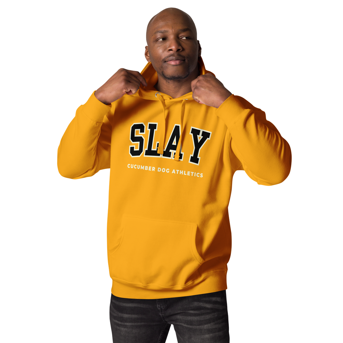 A man wearing a Gold pullover hoodie with 'SLAY' and 'CUCUMBER DOC ATHLETICS' printed on the front, posed against a solid white background.