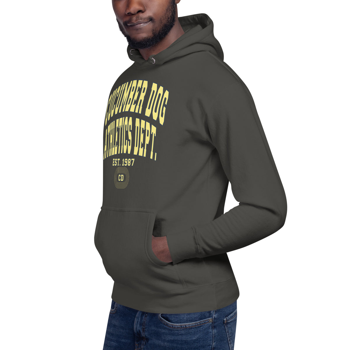 Premium vintage black hoodie featuring a vintage athletic graphic with arched Cucumber Dog and Athletics Dept text in solid butter cream block typography, above Est. 1987 and a track motif framing the CD monogram.
