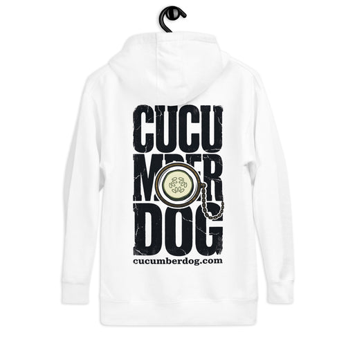 White hoodie featuring large distressed black Cucumber Dog text with a cucumber slice monocle and gold chain resting in the centre, and the website URL below.