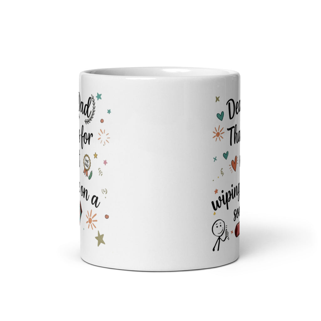 A white ceramic mug on a white surface. The design features playful, hand drawn style text that reads DEAR DAD THANKS FOR NOT WIPING ME ON A SOCK. The typography is surrounded by whimsical icons including a pink patterned sock, a smiling stick figure, a gold best child medal, and small sun and heart illustrations.