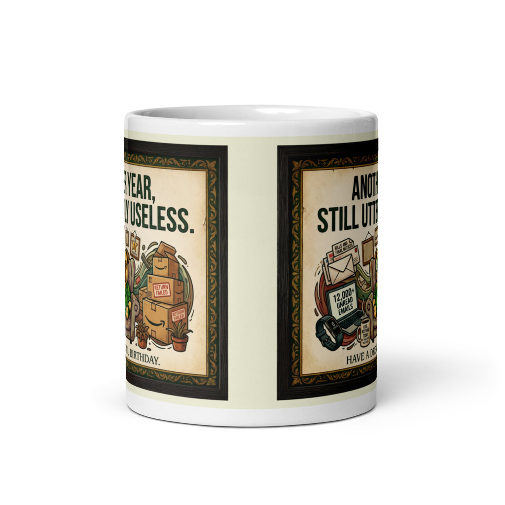 White glossy mug featuring Sir Cucumber Dog the pug. The text "ANOTHER YEAR... STILL UTTERLY USELESS." is rendered in Cucumber green. Cucumber Dog. 