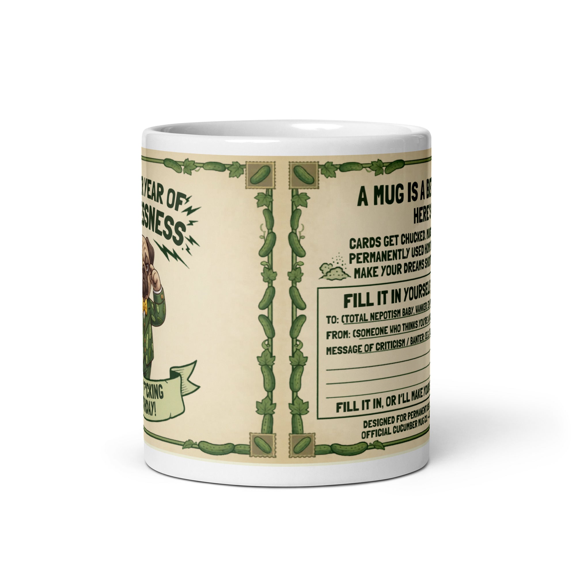 A two sided ceramic mug design on a cream background with a green cucumber border. The front features Sir Cucumber Dog in a green suit adjusting a monocle with the text ANOTHER YEAR OF USELESSNESS and HAPPY F*CKING BIRTHDAY. The back features text stating A MUG IS A BETTER CARD and a fill in the blank template for insults. 11 oz
