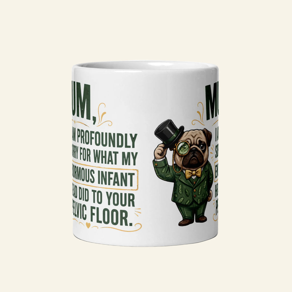 A white 11 oz ceramic coffee mug printed with a funny graphic of Sir Cucumber Dog in a green suit and top hat, alongside the quote: MUM, I AM PROFOUNDLY SORRY FOR WHAT MY ENORMOUS INFANT HEAD DID TO YOUR PELVIC FLOOR.