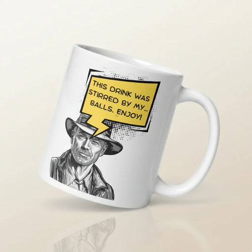 White ceramic mug with comic-style man in a hat and humorous speech bubble text graphic.
