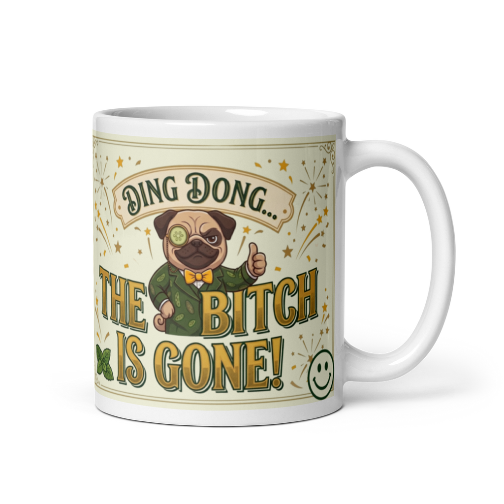 White glossy ceramic coffee mug featuring an illustration of Sir Cucumber Dog in a green suit with a monocle, giving a thumbs up, surrounded by gold starbursts and vintage text that reads Ding Dong The Bitch Is Gone!
