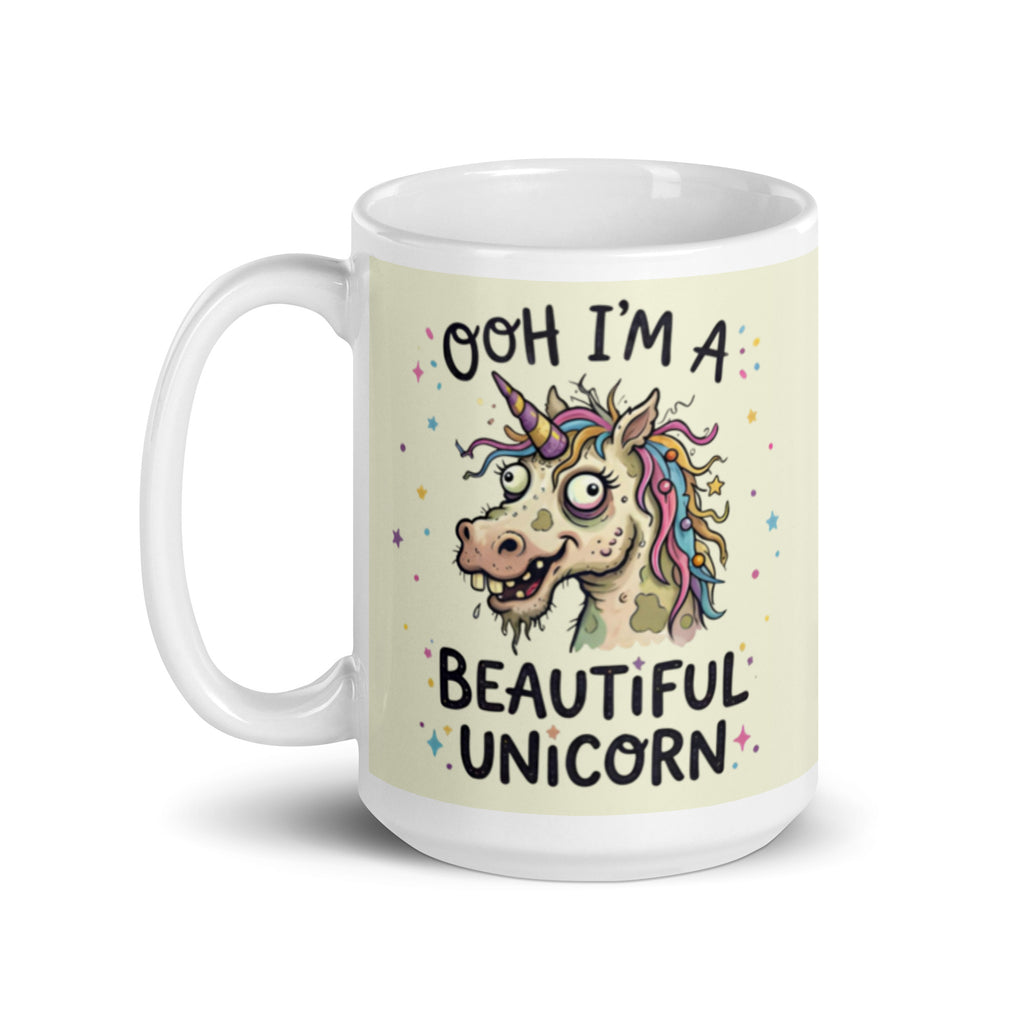 A funny, chaotic illustration on a white ceramic mug of a deranged, ugly unicorn with bloodshot eyes, crooked teeth, and messy pastel hair. The text reads OOH I'M A BEAUTIFUL UNICORN surrounded by small stars. 15 oz