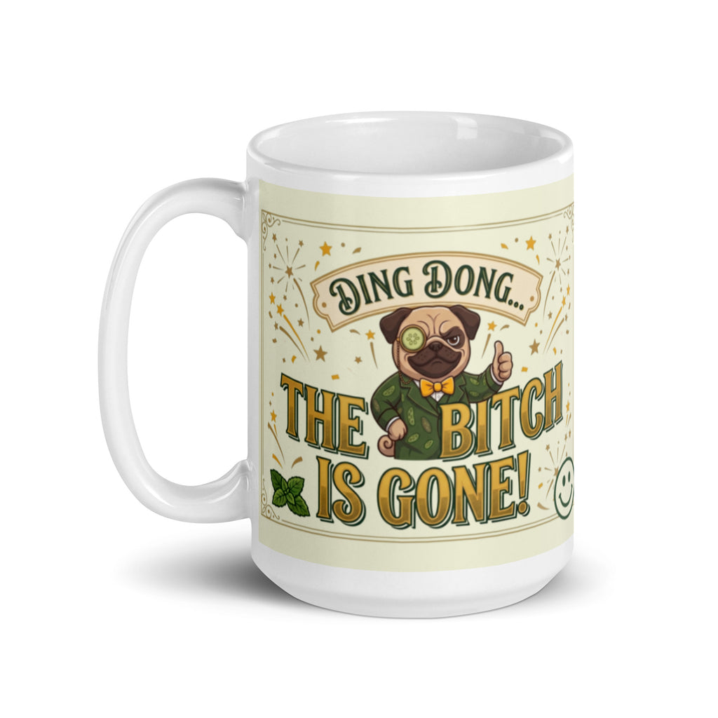 A funny, vintage-inspired graphic on a light cream background with a gold border. Features a pug named Sir Cucumber Dog wearing a monocle and a green suit, giving a thumbs up next to the bold text DING DONG... THE BITCH IS GONE! surrounded by illustrated fireworks. 15 oz