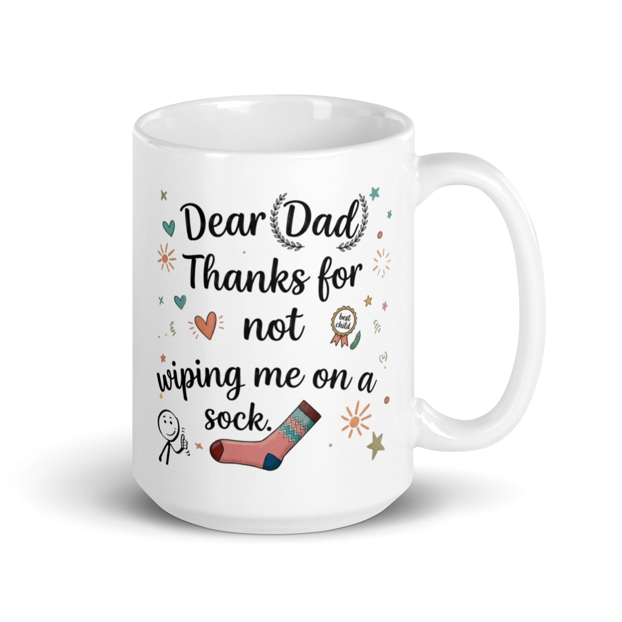 A white ceramic mug on a white surface. The design features playful, hand drawn style text that reads DEAR DAD THANKS FOR NOT WIPING ME ON A SOCK. The typography is surrounded by whimsical icons including a pink patterned sock, a smiling stick figure, a gold best child medal, and small sun and heart illustrations. 15oz