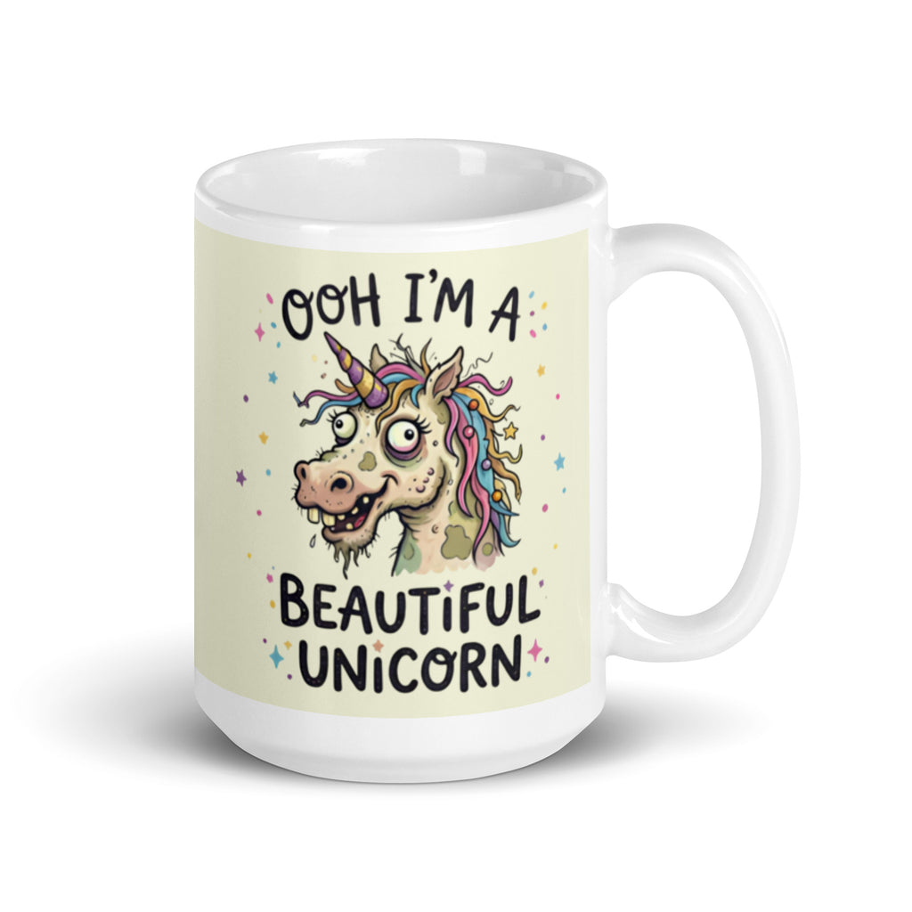 A funny, chaotic illustration on a white ceramic mug of a deranged, ugly unicorn with bloodshot eyes, crooked teeth, and messy pastel hair. The text reads OOH I'M A BEAUTIFUL UNICORN surrounded by small stars. 15 oz