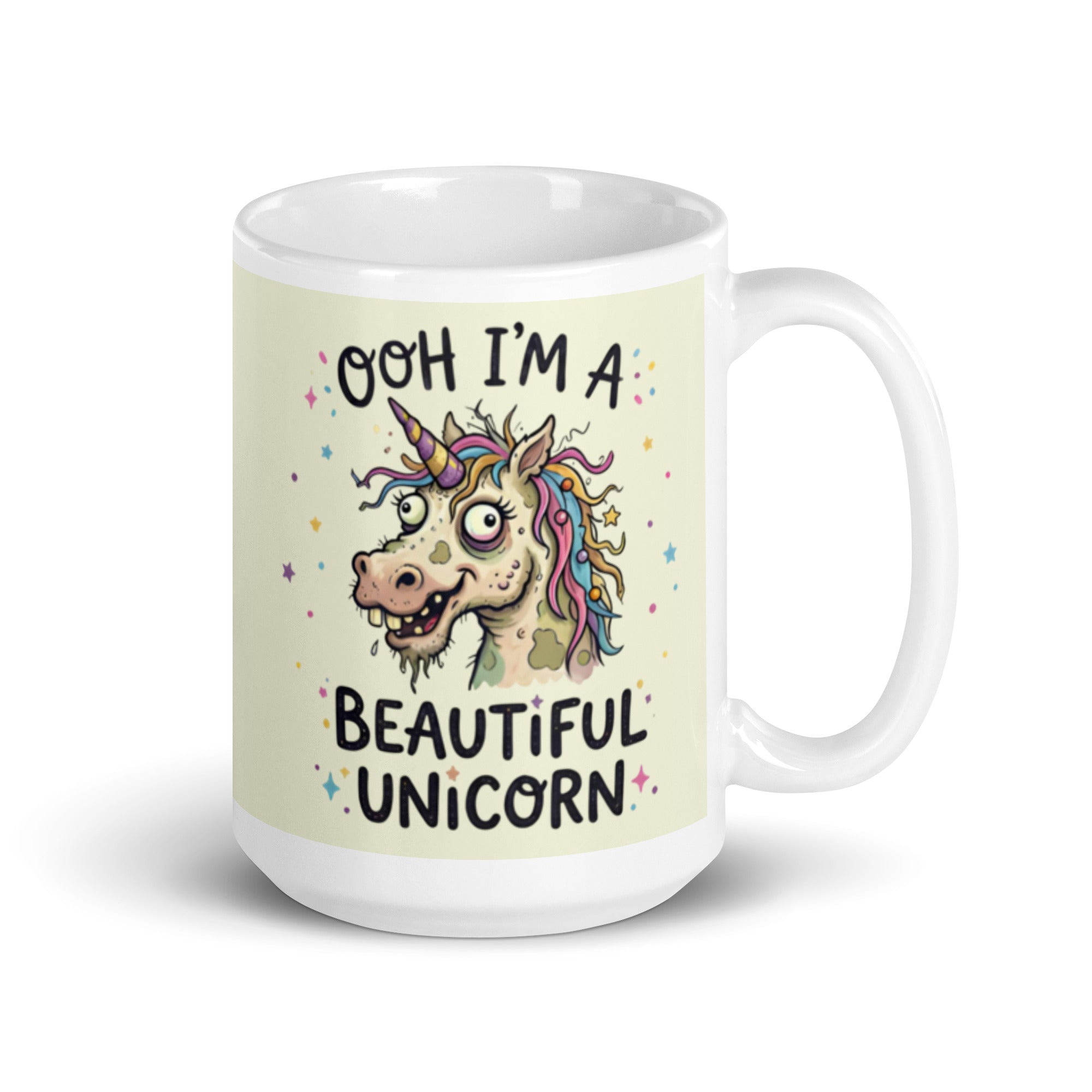 A funny, chaotic illustration on a white ceramic mug of a deranged, ugly unicorn with bloodshot eyes, crooked teeth, and messy pastel hair. The text reads OOH I'M A BEAUTIFUL UNICORN surrounded by small stars. 15 oz